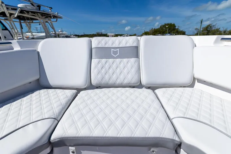 Slide: The Image of Luxurious seating on 2025 Sea Fox 328 Commander boat under clear blue sky. - 20