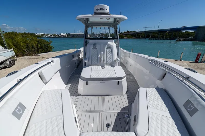 Slide: The Image of 2025 Sea Fox 328 Commander boat with spacious seating and modern design on a sunny day. - 21