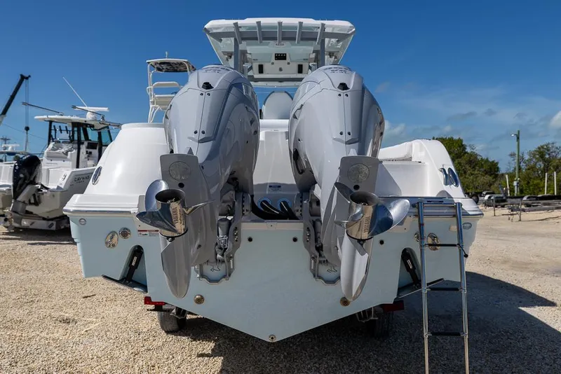 Slide: The Image of 2025 Sea Fox 328 Commander boat on trailer, featuring dual outboard engines. - 4