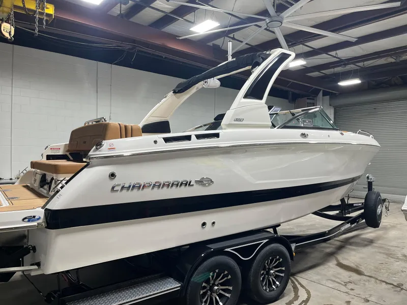 Slide: The Image of 2025 Chaparral 267 SSX boat on trailer at Hern Marine dealership. - 0