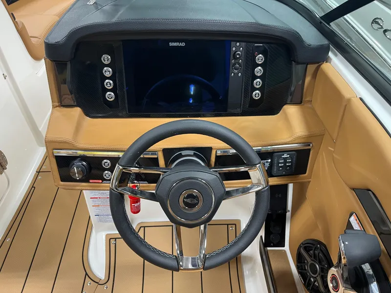 Slide: The Image of 2025 Chaparral 267 SSX boat interior bathroom with sink and toilet. - 12