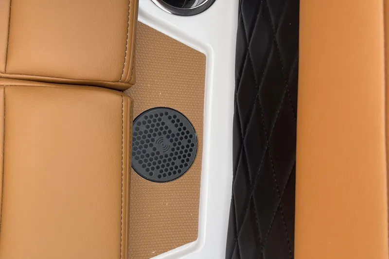 Slide: The Image of 2025 Chaparral 267 SSX interior detail with tan and black leather upholstery. - 18