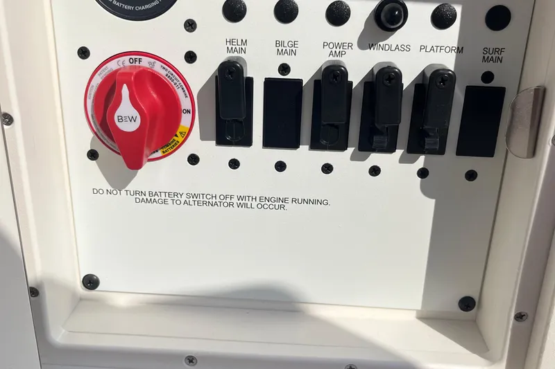 Slide: The Image of 2025 Chaparral 267 SSX boat control panel with battery switch and warning label. - 20