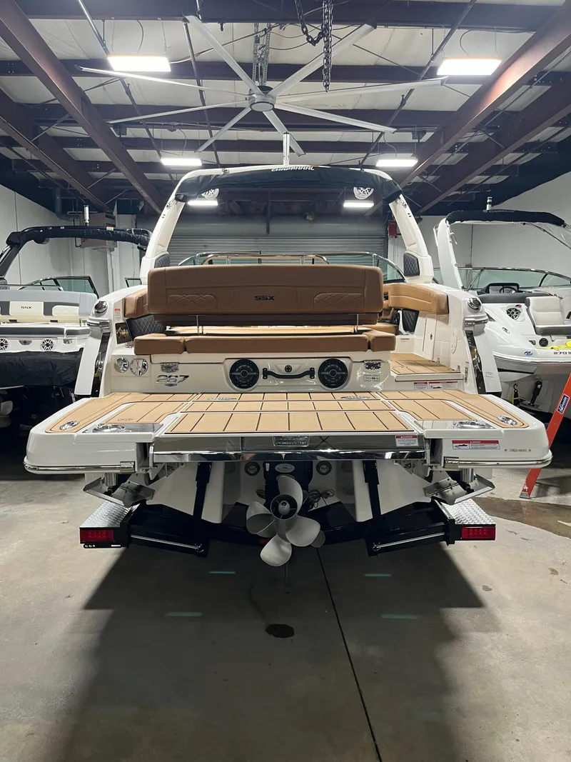 Slide: The Image of 2025 Chaparral 267 SSX boat anchor compartment with chain and cleat. - 5