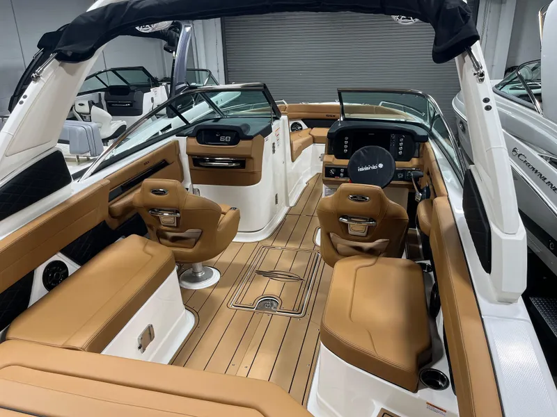 Slide: The Image of 2025 Chaparral 267 SSX boat interior with tan leather seating and sleek design. - 6