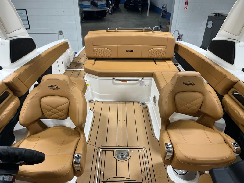 Slide: The Image of 2025 Chaparral 267 SSX dashboard with steering wheel and navigation display. - 9