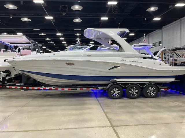 Slide: The Image of 2025 Crownline Eclipse E305 boat on display in a showroom. - 0