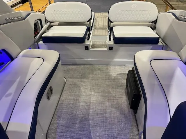 Slide: The Image of 2025 Crownline Eclipse E305 boat interior with luxurious seating and modern design. - 7