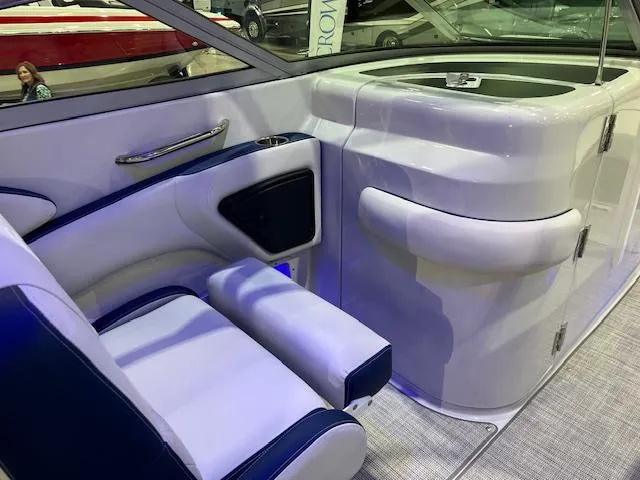 Slide: The Image of 2025 Crownline Eclipse E305 boat interior with luxurious seating and sleek design. - 8