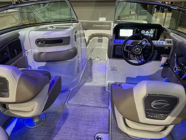 Slide: The Image of Interior of 2025 Crownline Eclipse E285 boat with modern dashboard and seating. - 3