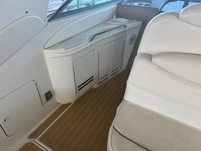 Slide: The Image of Interior of 2000 Sea Ray 340 Sundancer yacht with white seating and cabinetry. - 16