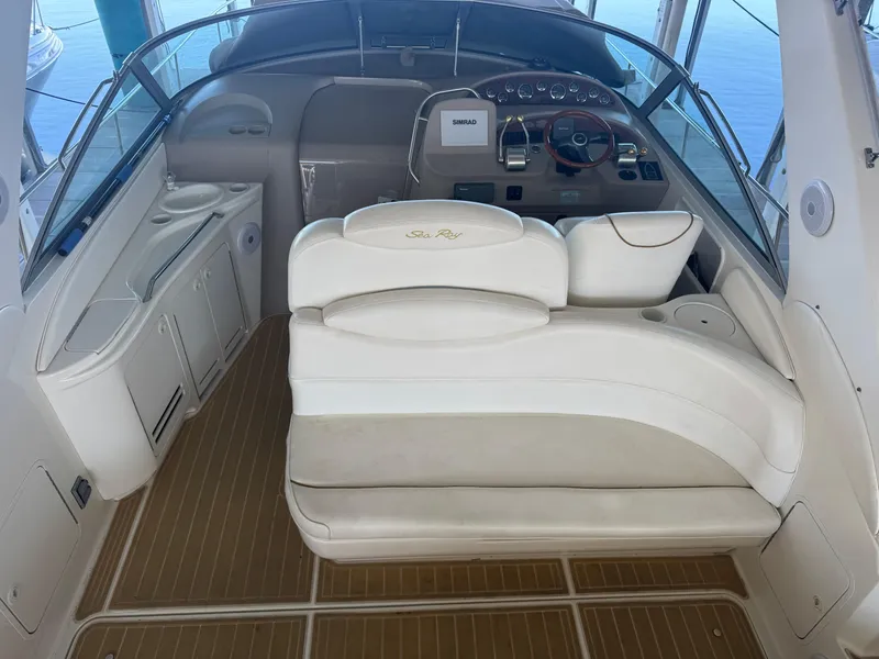 Slide: The Image of 2000 Sea Ray 340 Sundancer boat interior with helm and seating area. - 17