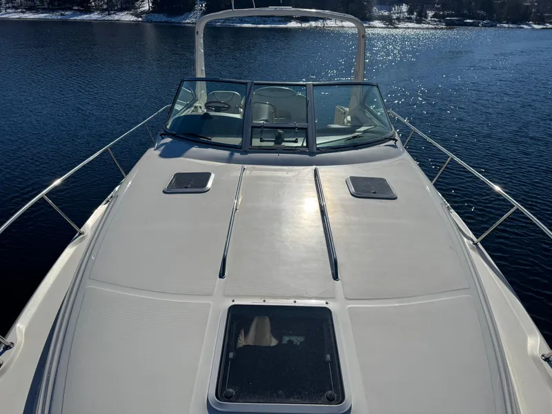 Slide: The Image of 2000 Sea Ray 340 Sundancer boat on calm water, sunny day. - 6
