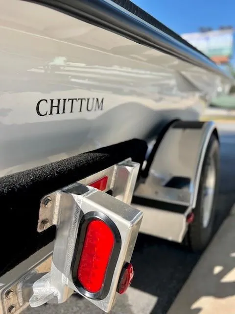 Slide: The Image of 2024 Chittum Skiffs 18 Islamorada boat on trailer, close-up view. - 10