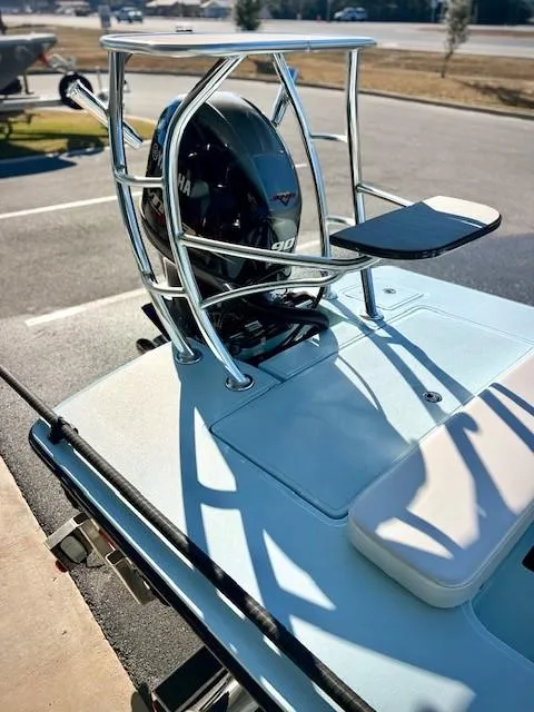 Slide: The Image of 2024 Chittum Skiffs 18 Islamorada boat with Yamaha engine and sleek design. - 2