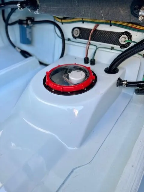 Slide: The Image of 2024 Chittum Skiffs 18 Islamorada boat interior with wiring and red access hatch. - 3