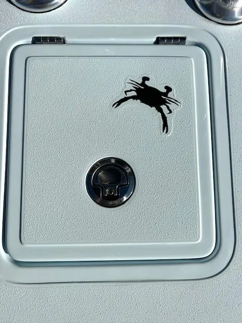 Slide: The Image of 2024 Chittum Skiffs 18 Islamorada hatch with crab logo detail. - 6