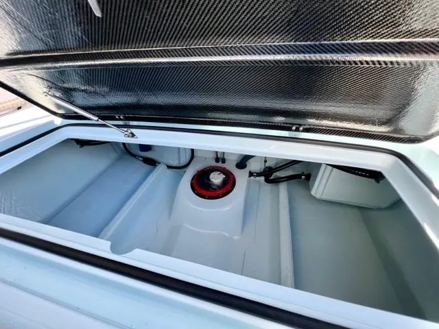 Slide: The Image of Open storage compartment of 2024 Chittum Skiffs 18 Islamorada boat. - 8