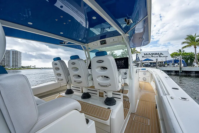 Slide: The Image of Interior view of 2016 HCB 53 Sueños boat with luxurious seating and helm. - 11