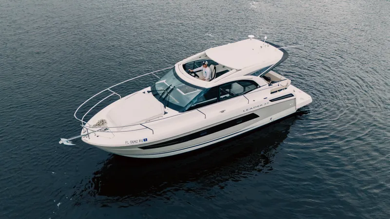 Slide: The Image of 2019 Jeanneau Leader 33 cruising on calm waters, aerial view. - 1