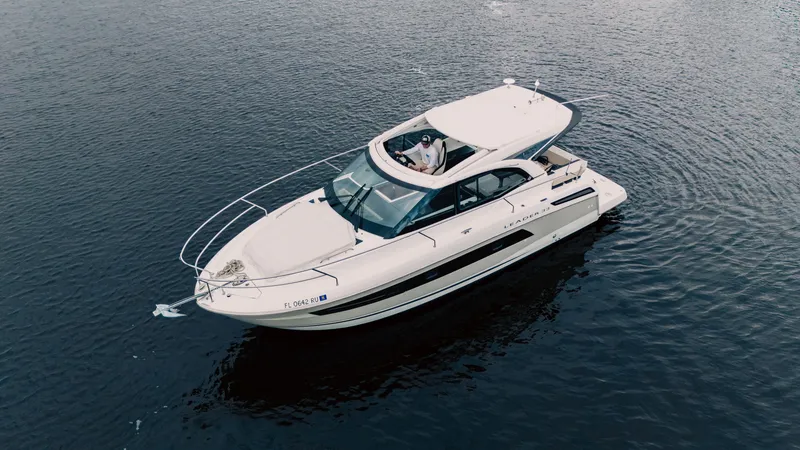 Slide: The Image of 2019 Jeanneau Leader 33 yacht cruising on open water. - 3