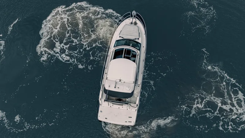 Slide: The Image of Aerial view of 2019 Jeanneau Leader 33 yacht cruising through ocean waters. - 7