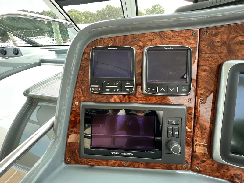 Slide: The Image of Control panel of a 2014 Formula 45 Yacht with navigation displays. - 11