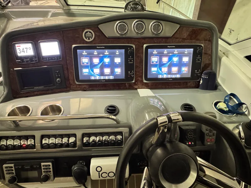 Slide: The Image of Control panel of a 2014 Formula 45 Yacht with dual navigation screens. - 15
