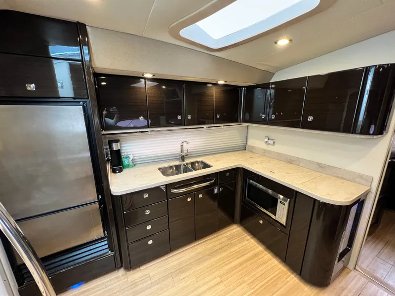 Slide: The Image of Luxurious kitchen interior of 2014 Formula 45 Yacht with modern appliances and sleek cabinetry. - 18