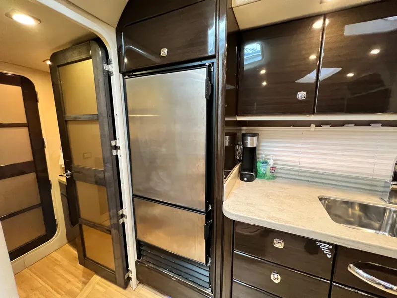 Slide: The Image of Interior of 2014 Formula 45 Yacht kitchen with stainless steel fridge and modern cabinetry. - 19