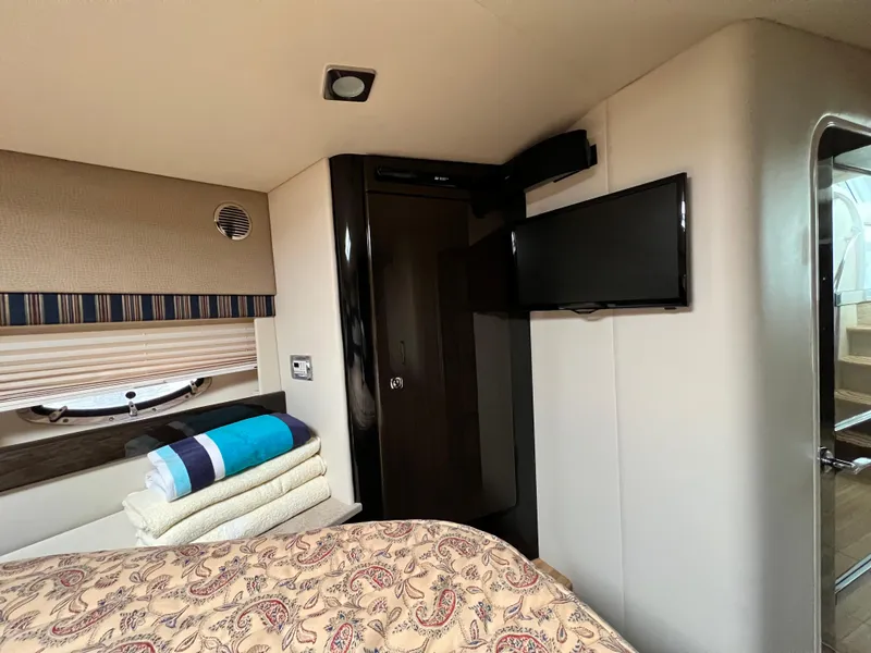 Slide: The Image of Interior of 2014 Formula 45 Yacht with TV, bed, and folded towels. - 24