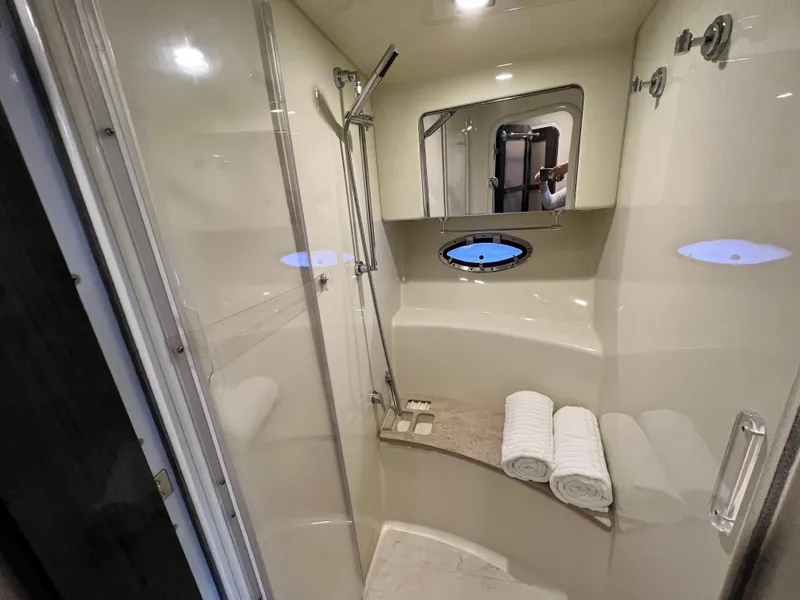 Slide: The Image of Luxurious shower in 2014 Formula 45 Yacht with modern fixtures and porthole window. - 26