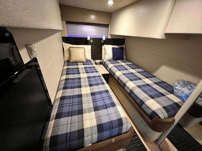 Slide: The Image of Cozy twin cabin beds in 2014 Formula 45 Yacht with plaid bedding. - 27