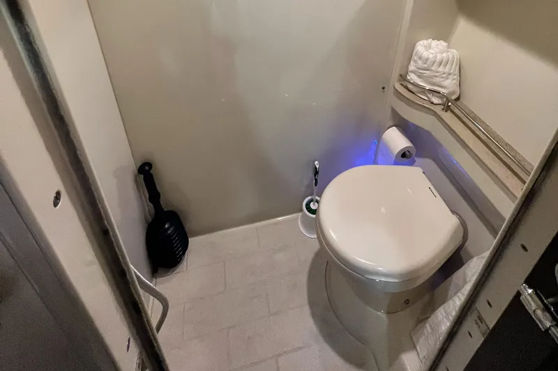 Slide: The Image of 2014 Formula 45 Yacht bathroom with modern toilet and storage shelf. - 29