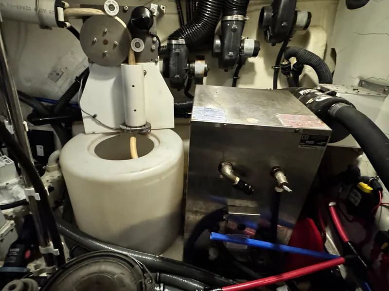 Slide: The Image of Engine room of 2014 Formula 45 Yacht with mechanical components and hoses. - 39