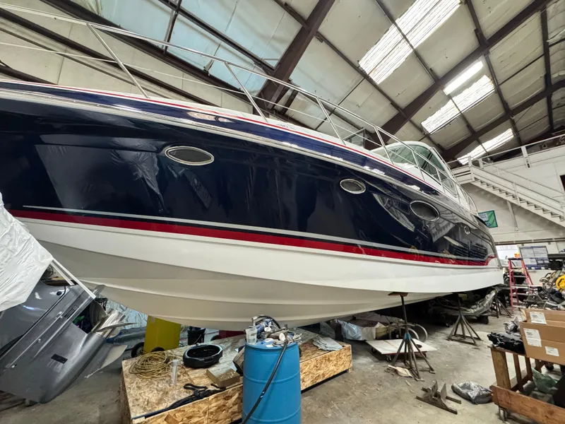 Slide: The Image of 2014 Formula 45 Yacht in a warehouse, undergoing maintenance. - 40