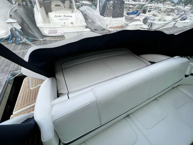 Slide: The Image of 2014 Formula 45 Yacht interior with white leather seating at marina. - 5