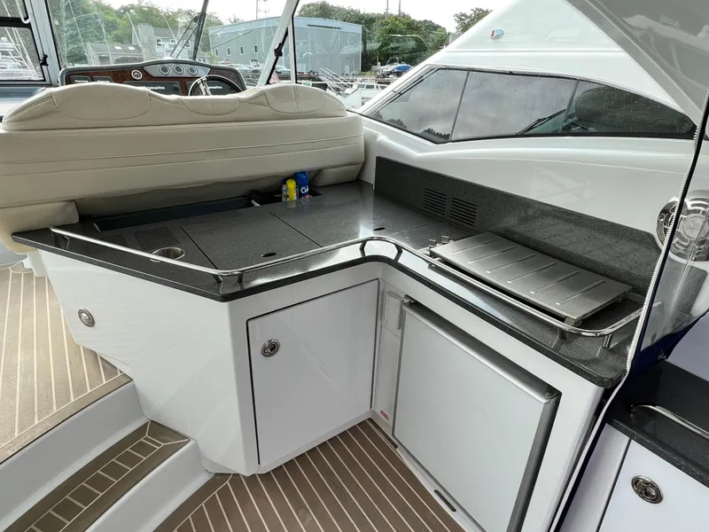 Slide: The Image of 2014 Formula 45 Yacht interior with sleek kitchenette and modern design. - 6