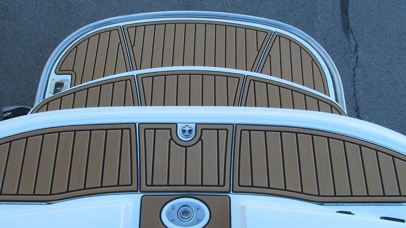 Slide: The Image of Cobalt 250 boat deck, 2006 model, featuring teak-style flooring. - 17