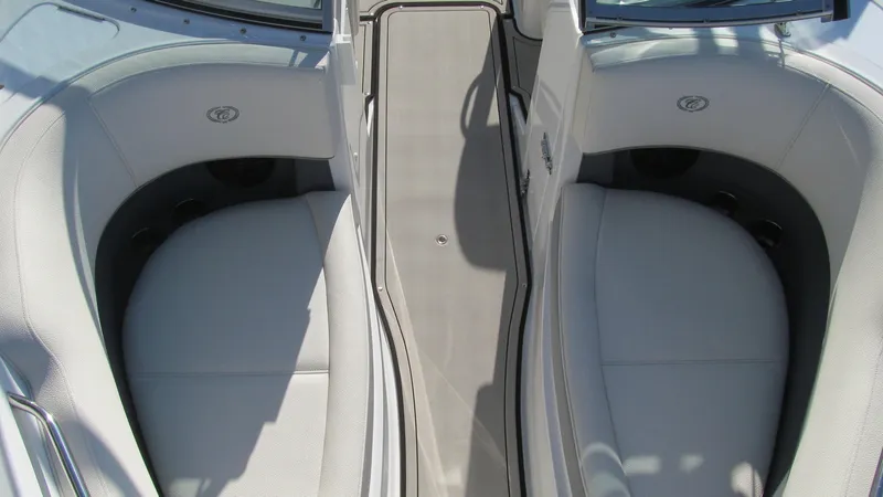 Slide: The Image of 2018 Cobalt 220S boat interior with white seating and sleek design. - 11
