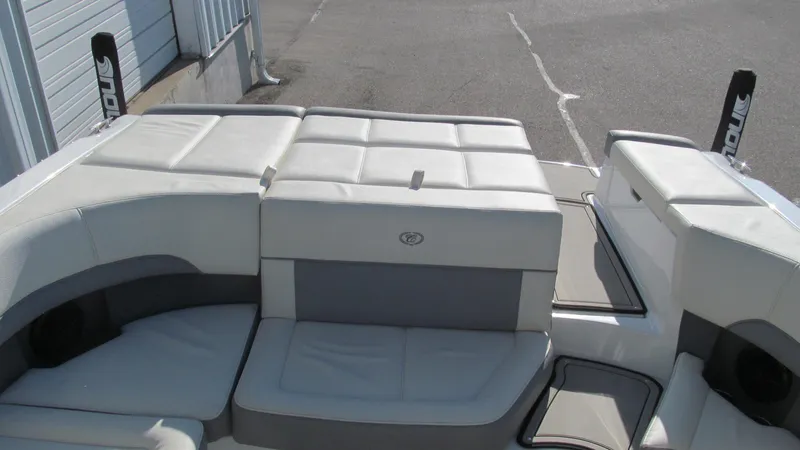 Slide: The Image of 2018 Cobalt 220S boat interior with white and gray seating. - 12