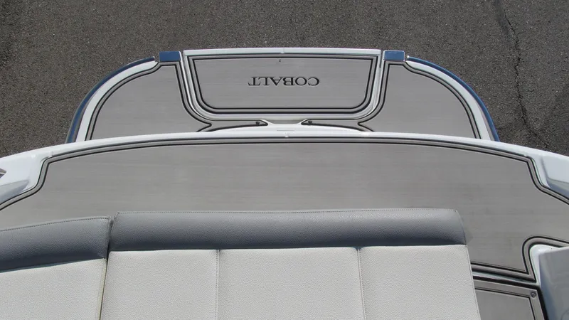Slide: The Image of 2018 Cobalt 220S boat deck with cushioned seating and sleek design. - 14
