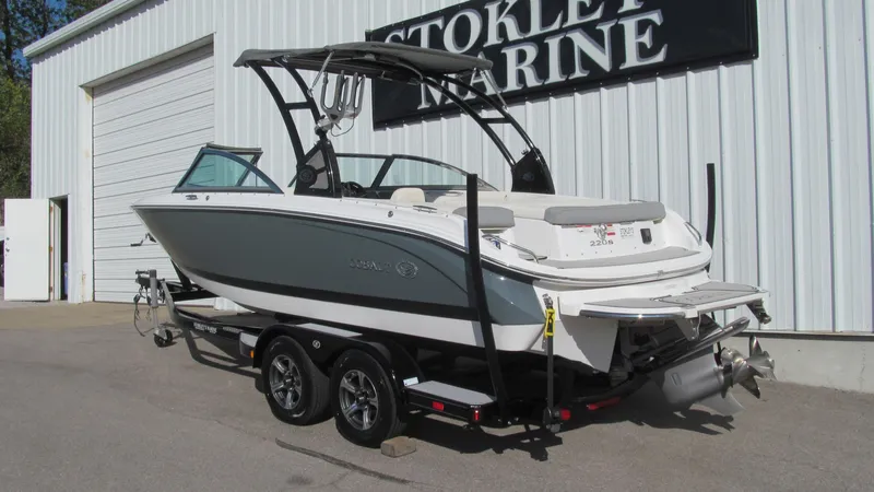 Slide: The Image of 2018 Cobalt 220S boat on trailer outside marine dealership. - 2