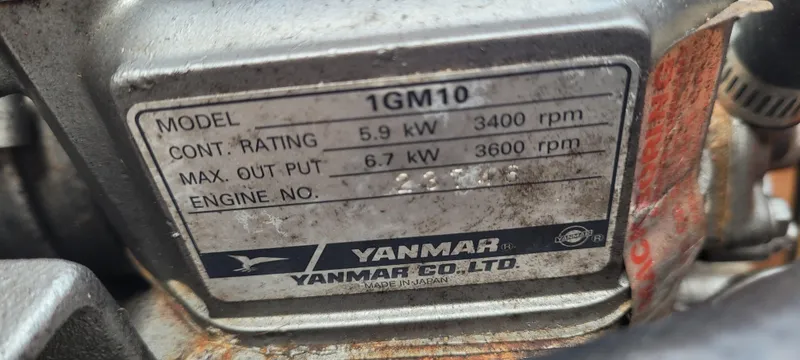 Slide: The Image of Yanmar engine label showing model 1GM10 specifications, including power ratings and RPM details. - 18