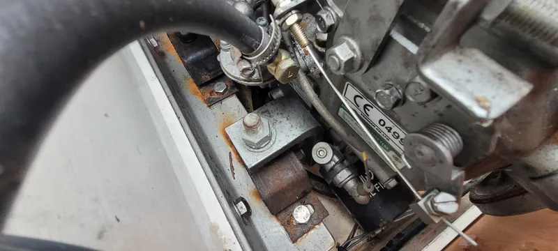 Slide: The Image of Engine components of a 2009 Golant Gaffer Cutter Rig, showing bolts and metal parts. - 20