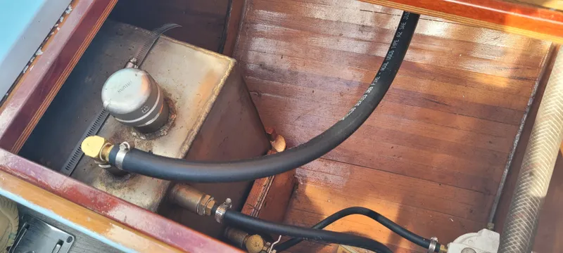 Slide: The Image of Engine compartment of 2009 Golant Gaffer Cutter Rig with fuel tank and hoses. - 24