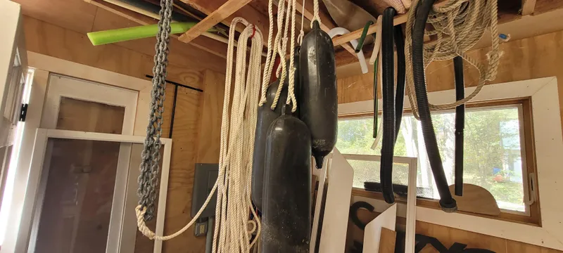 Slide: The Image of Hanging ropes and fenders in a wooden shed, Golant Gaffer Cutter Rig, 2009. - 27