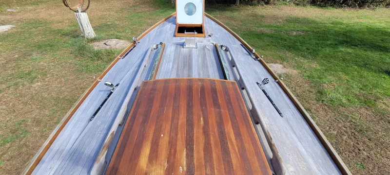 Slide: The Image of Golant Gaffer Cutter Rig 2009 boat deck with wooden finish, viewed from above. - 28