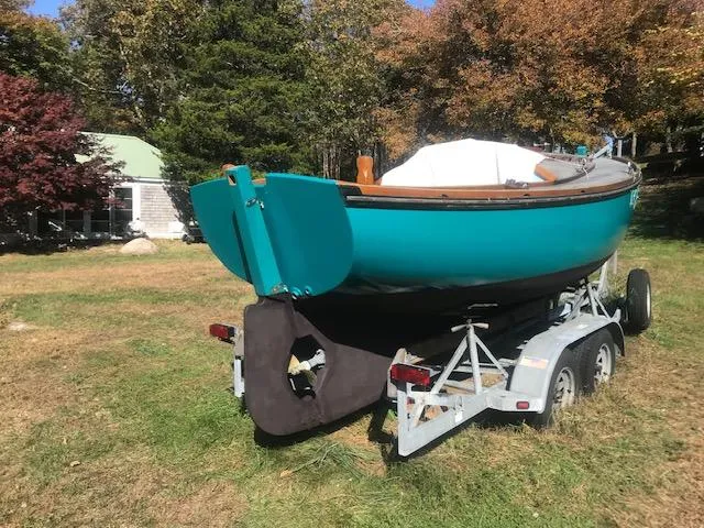 Slide: The Image of Turquoise Golant Gaffer Cutter Rig boat on trailer, 2009 model, in grassy yard. - 62