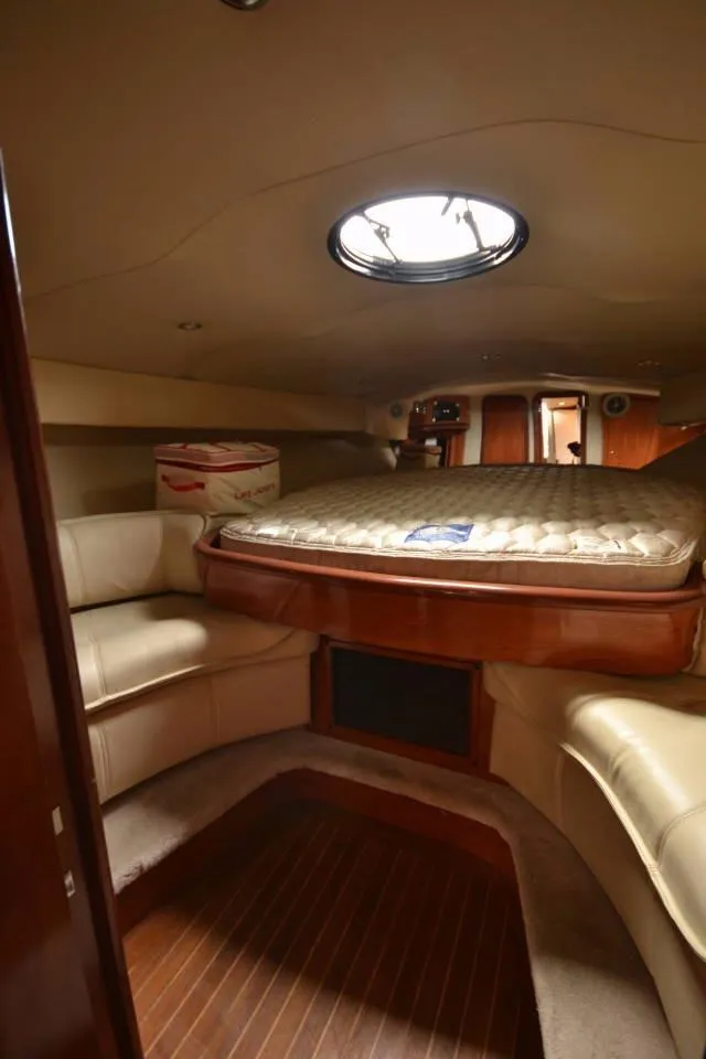 Slide: The Image of Interior of 2006 Fountain 48 Express Cruiser with cozy cabin and circular skylight. - 15